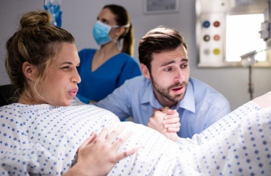 man-comforting-pregnant-woman-during-labor_107420-63879